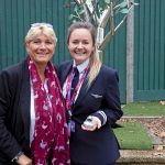 Student and a teacher, with the student holding a glittery duck