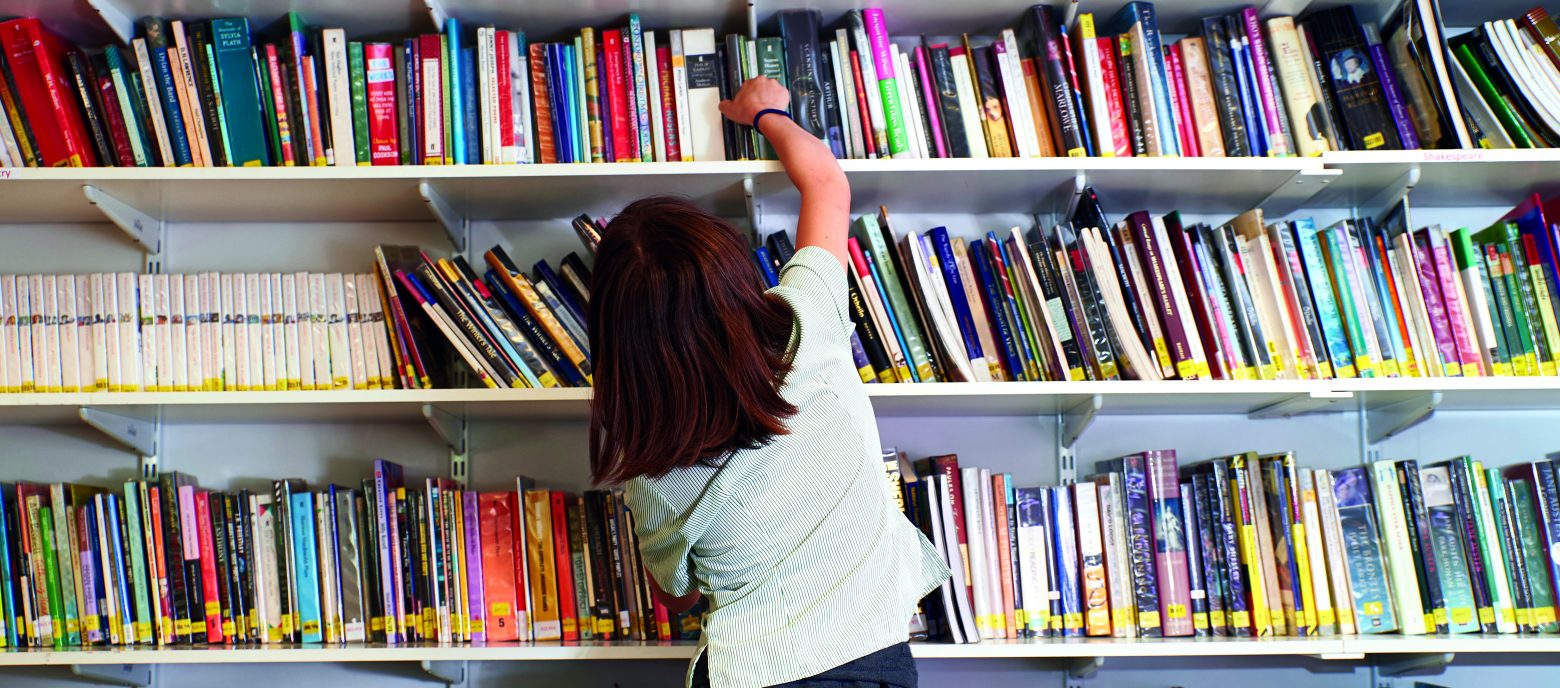 student picking out a book