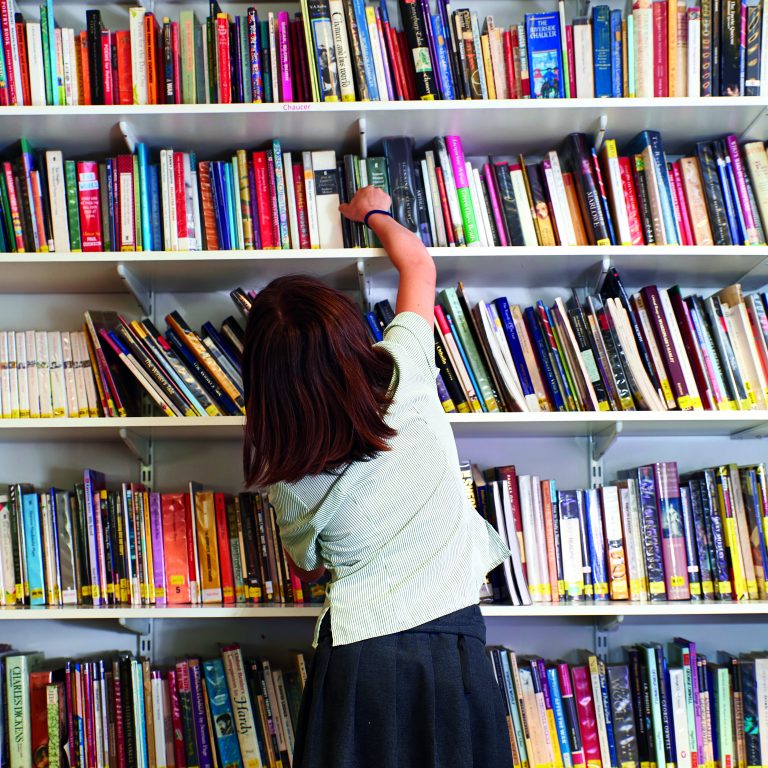 student picking out a book