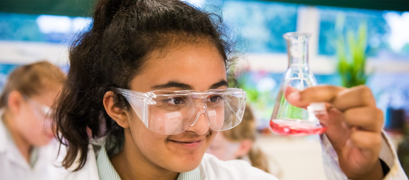 student and conical flask