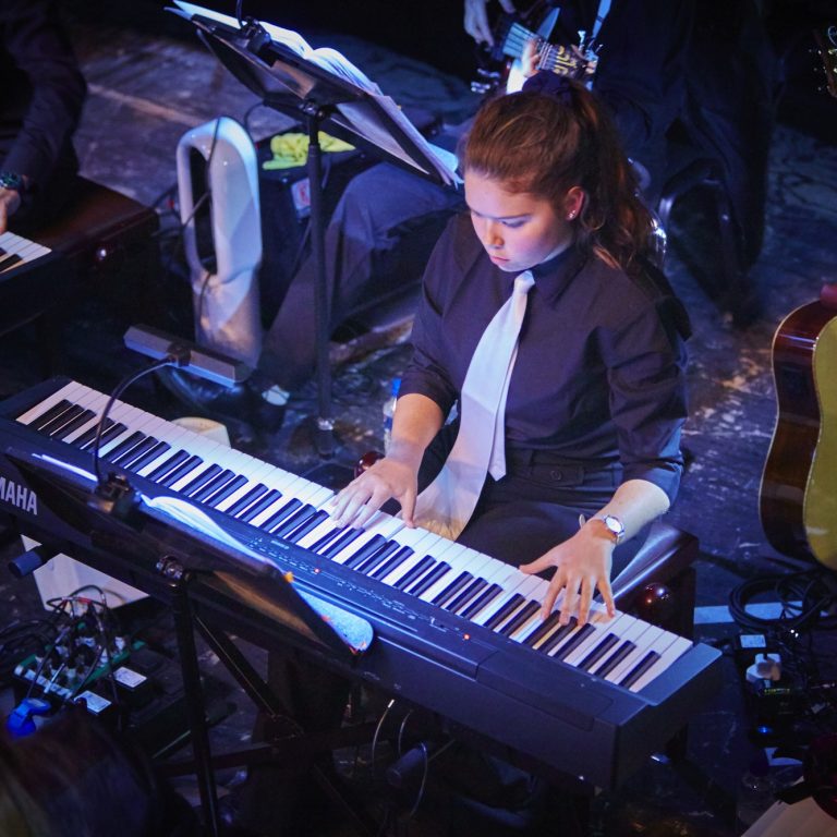 student playing the piano