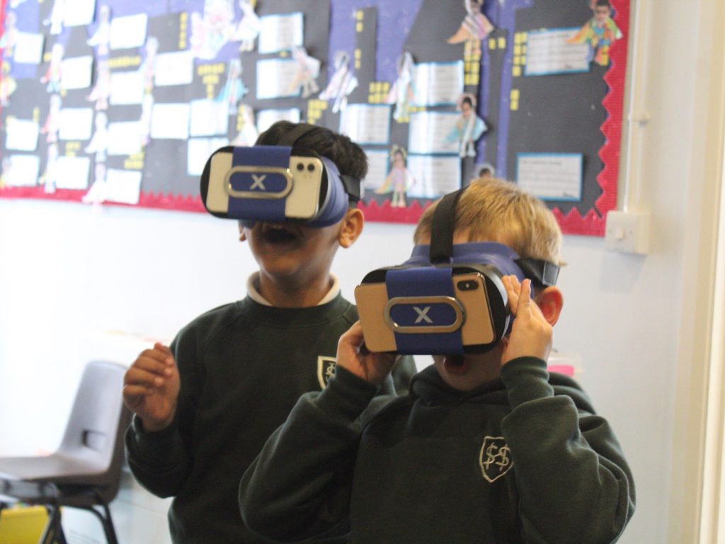 boys wearing vr headsets