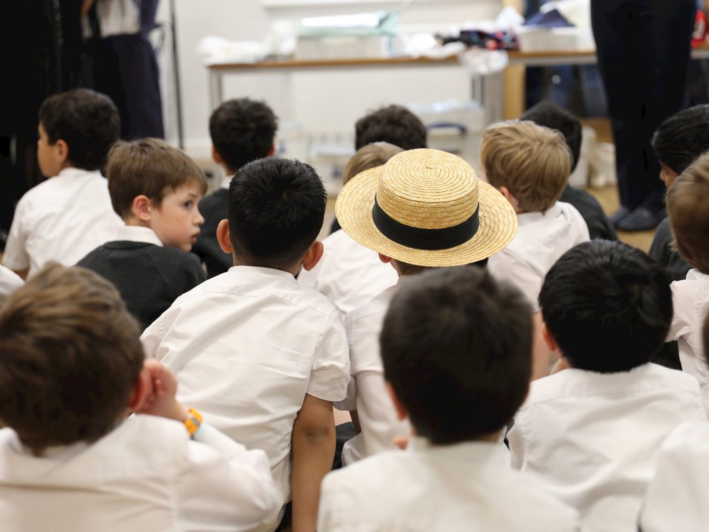 students sat down on the floor