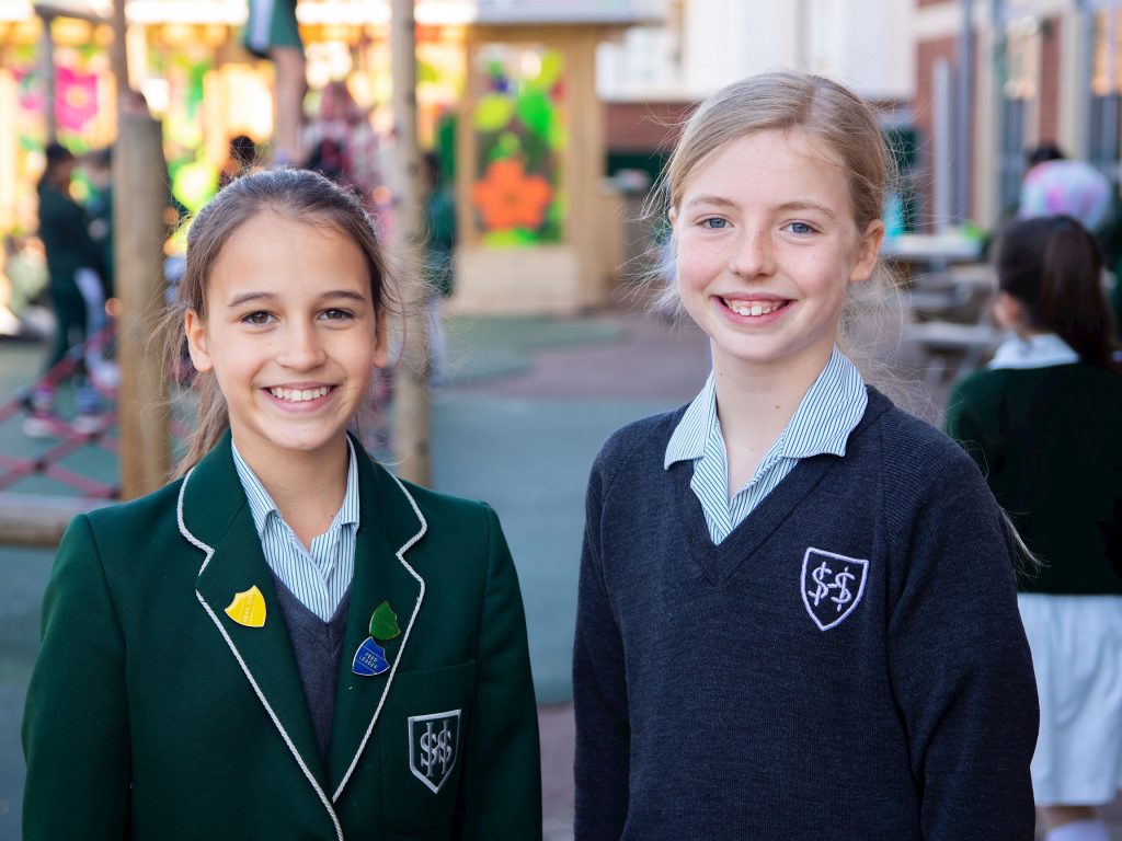 2 students in school uniform