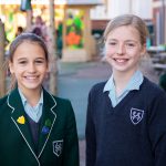 2 students in school uniform