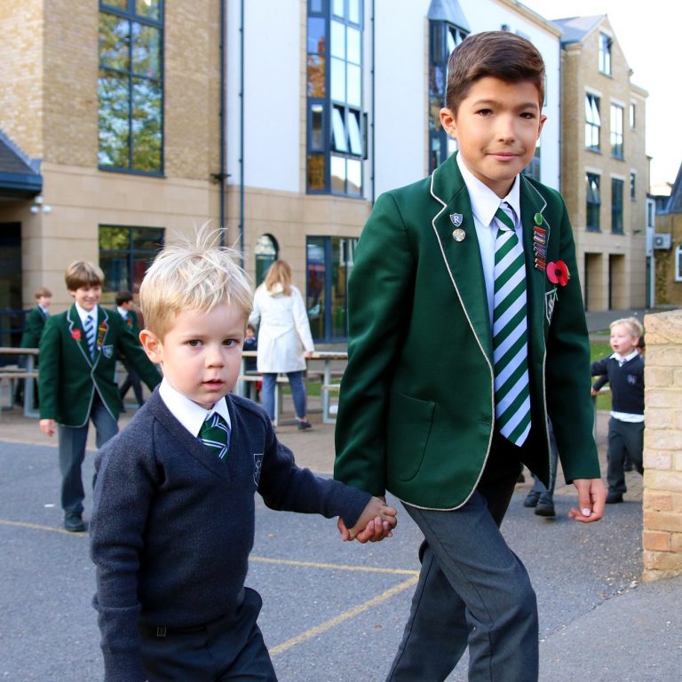 Two boys walking hand in hand