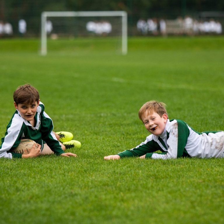 Students having a laugh during their football game