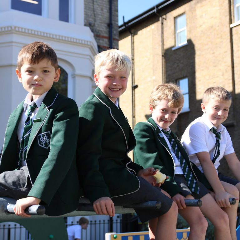 students sat on a wall