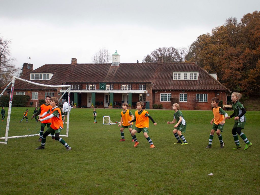 boys playing football