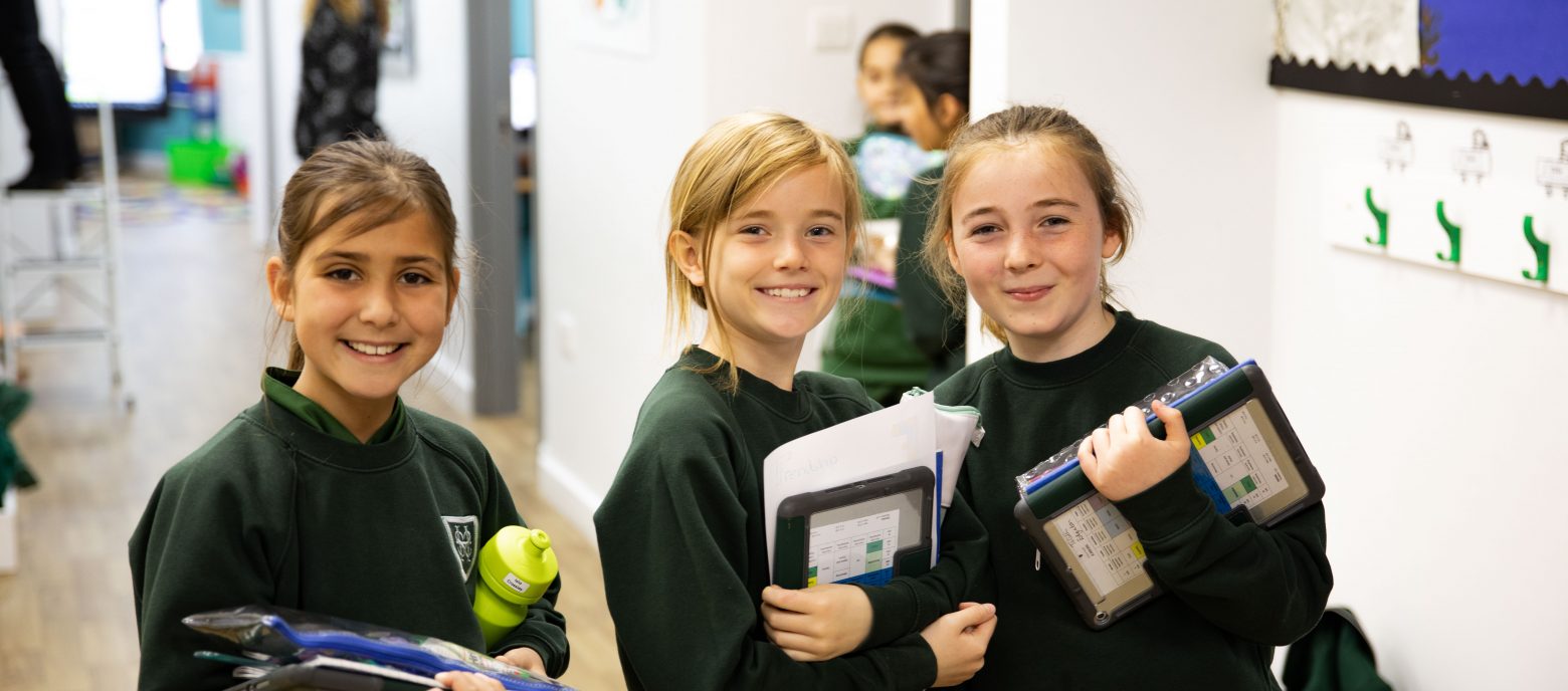 girls carrying their work