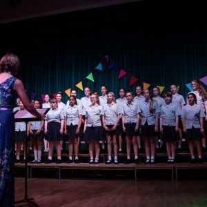 teacher directing group of pupils