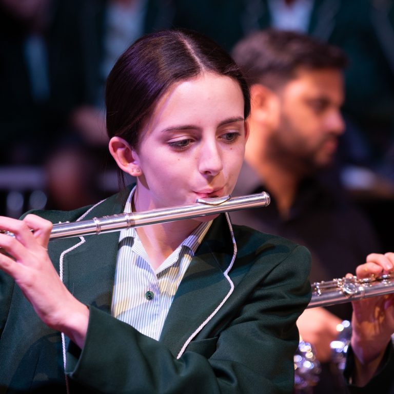 student playing the flute