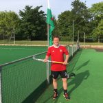 man holding a hockey stick