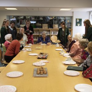 students and teachers eating buffet food