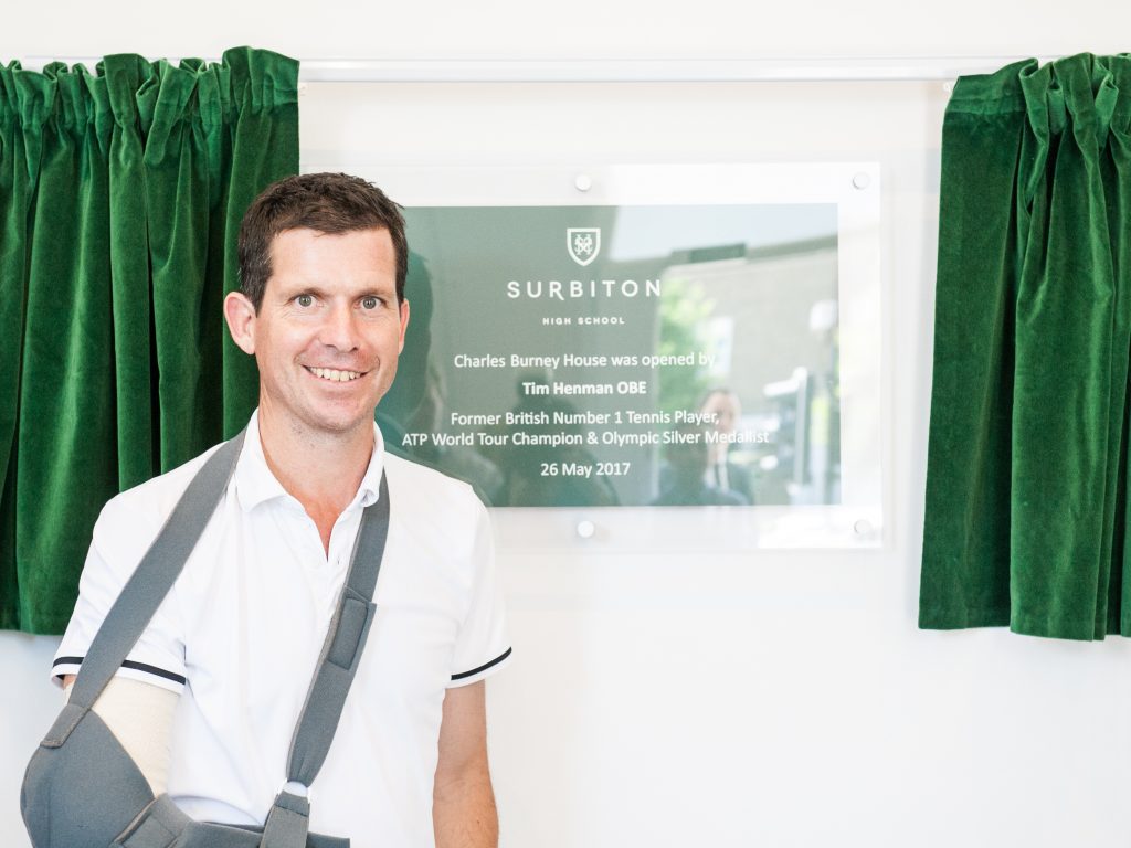 Tim Henman with his arm in a sling