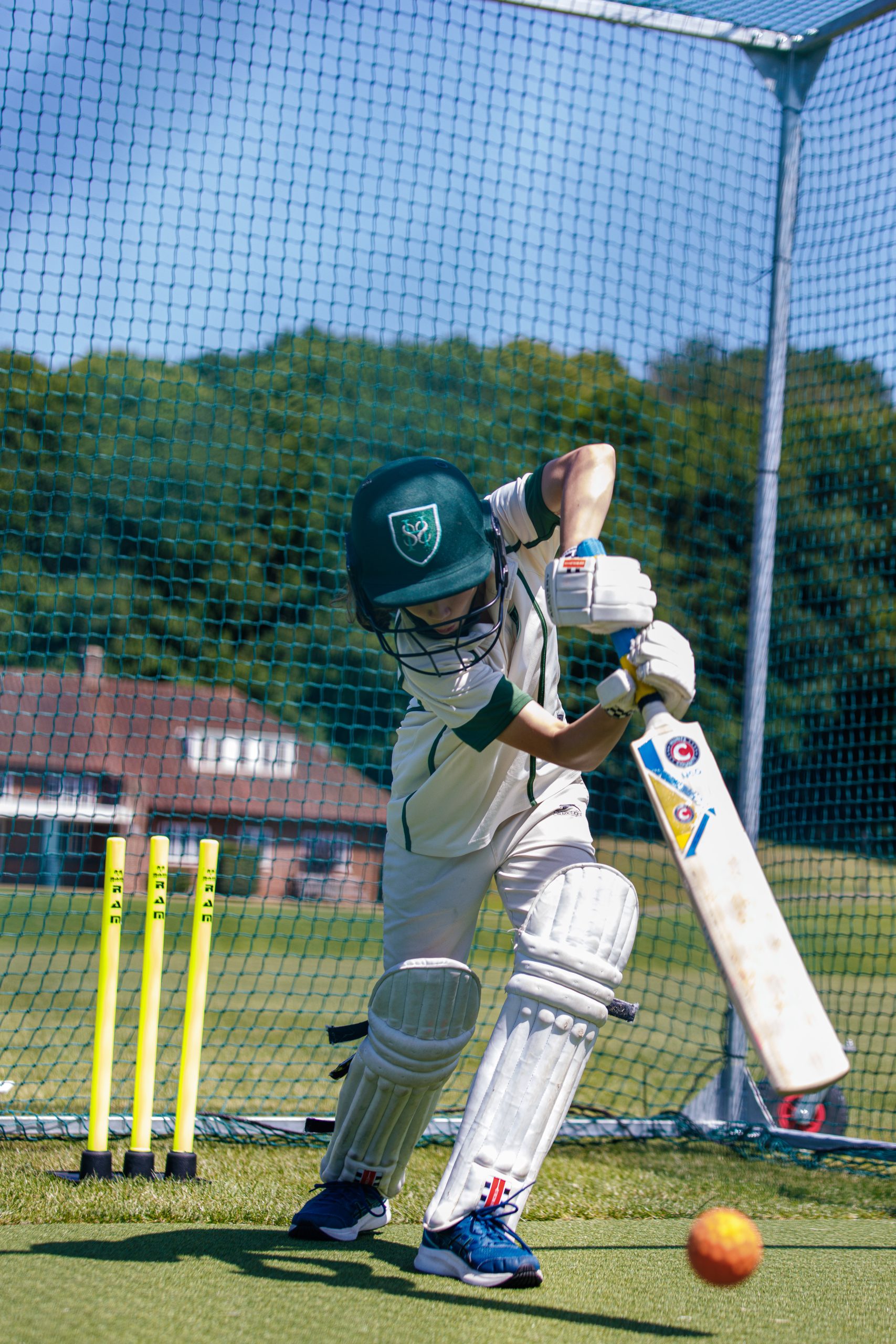 boy playing cricket