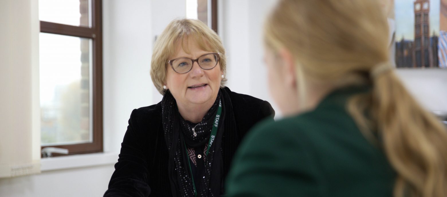 teacher talking to a student