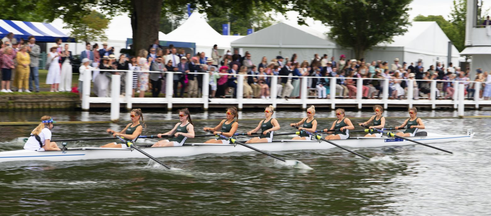 students rowing in a boat