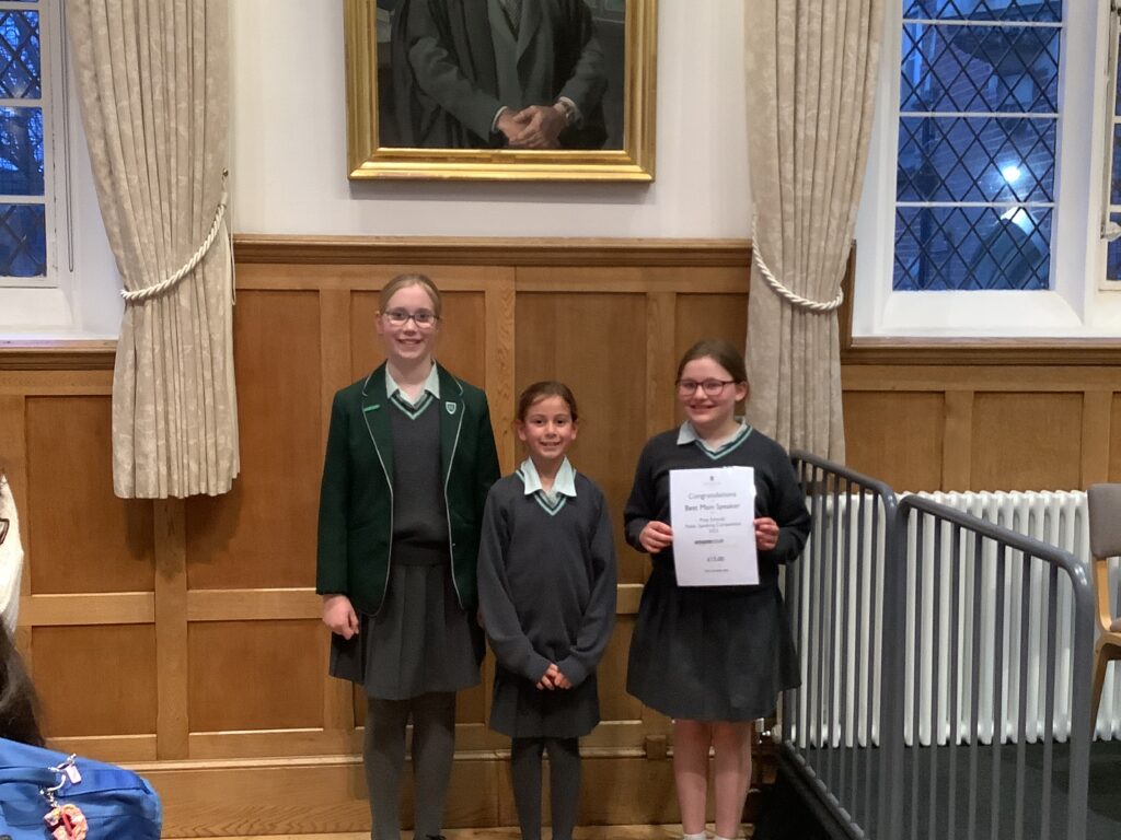 girls stood with a certificate