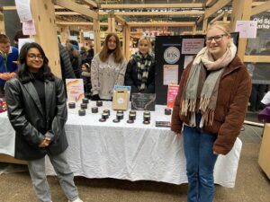 Surbiton High students at a stand selling candles.