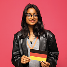 student holding the german flag