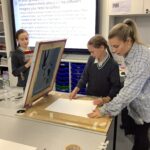 Women with two school girls screen printing