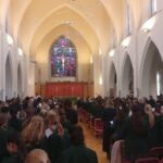 Church hall with the back of pupils