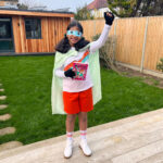 Girl standing in garden dressed up for World Book Day