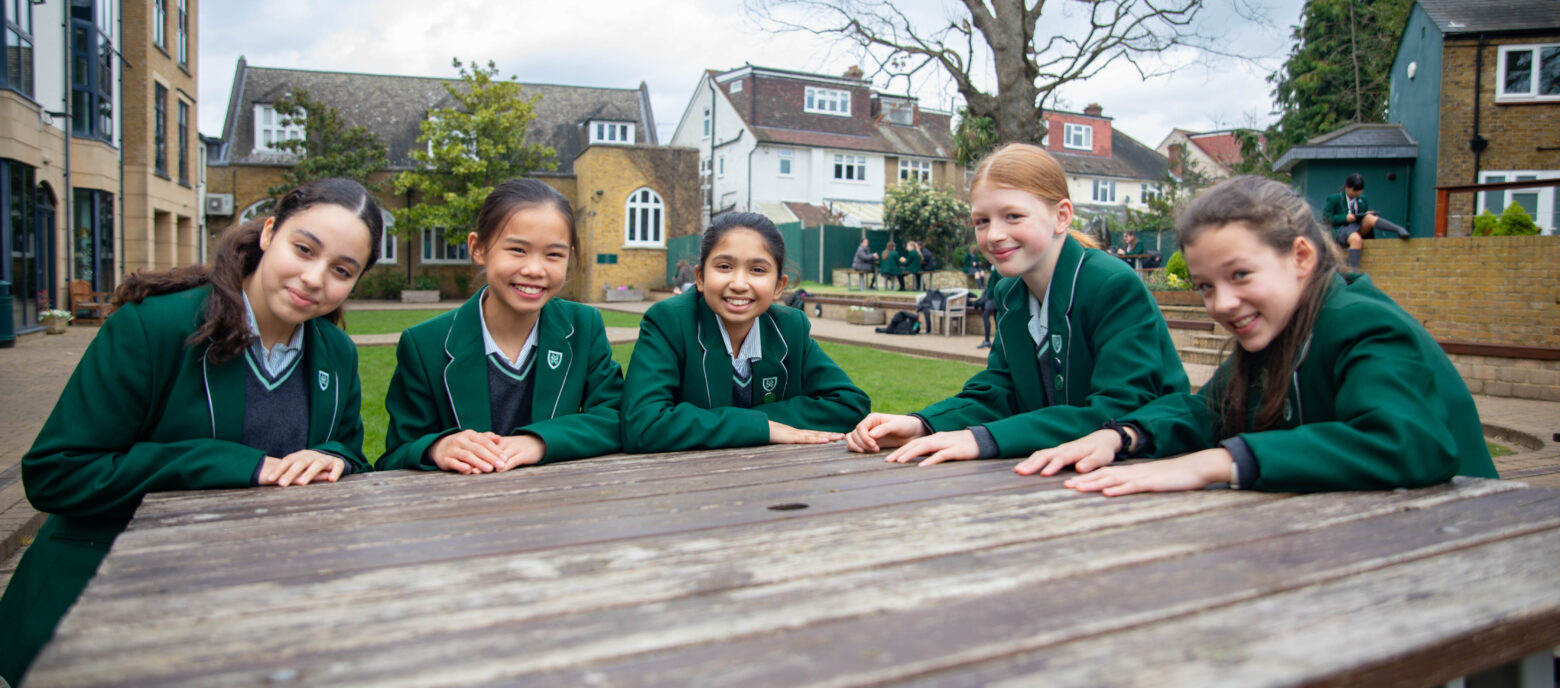 prep students sat at a bench