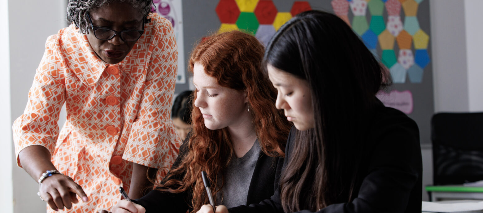 students and a teacher in a maths session
