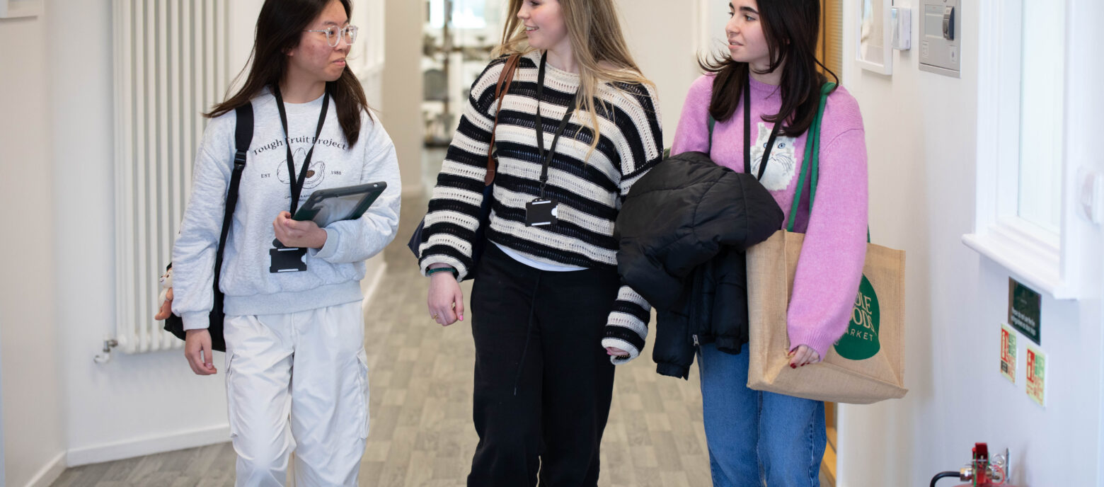 girls walking down a hallway