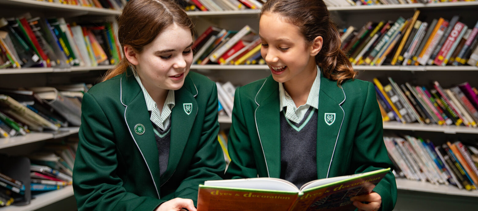 girls reading in a library